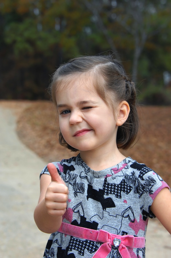 Thumbs Up by a Little Girl Photography 